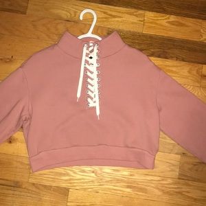 Pink cropped sweater with white strings